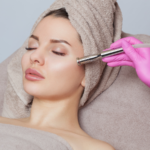 Woman receiving a professional microdermabrasion treatment during a microdermabrasion vs dermaplaning skincare consultation