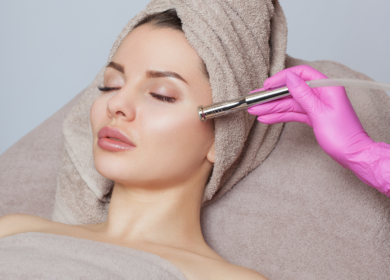 Woman receiving a professional microdermabrasion treatment during a microdermabrasion vs dermaplaning skincare consultation
