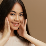 Female model with glowing smooth skin representing results discussed in does dermaplaning cause more facial hair myth debunking blog