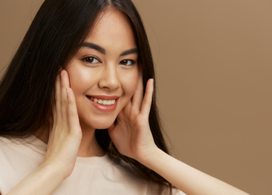 Female model with glowing smooth skin representing results discussed in does dermaplaning cause more facial hair myth debunking blog