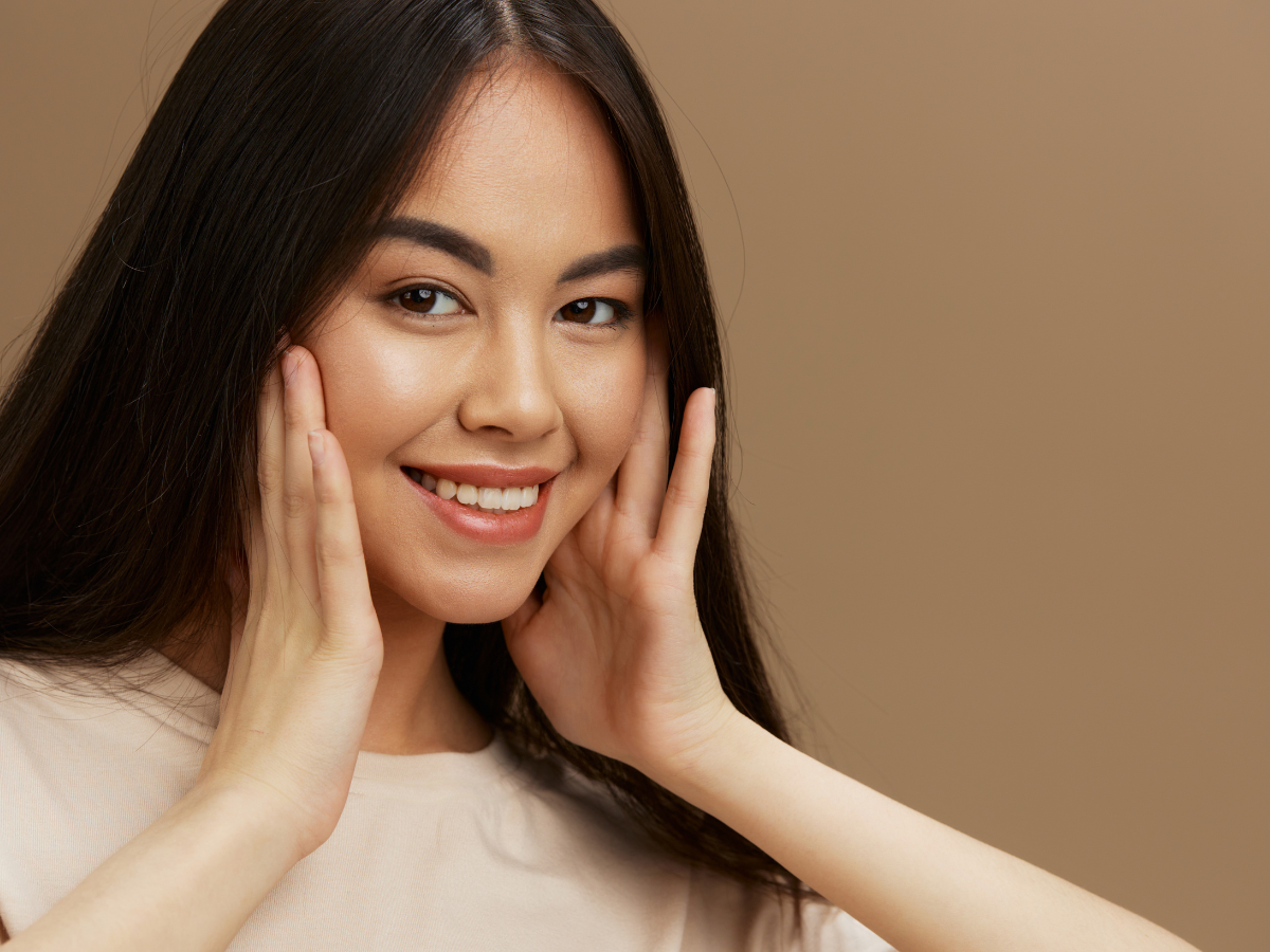 Female model with glowing smooth skin representing results discussed in does dermaplaning cause more facial hair myth debunking blog