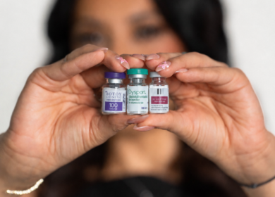 Injector comparing Dysport and Botox wrinkle relaxer vials at a San Antonio med spa